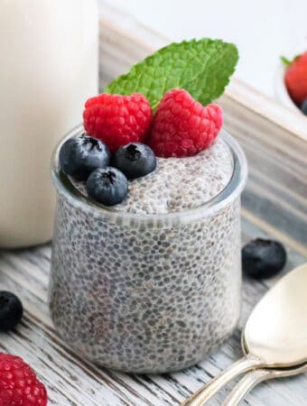 chia seed pudding in jar garnished with fresh fruit
