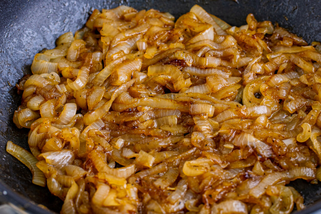 coke onions in pan