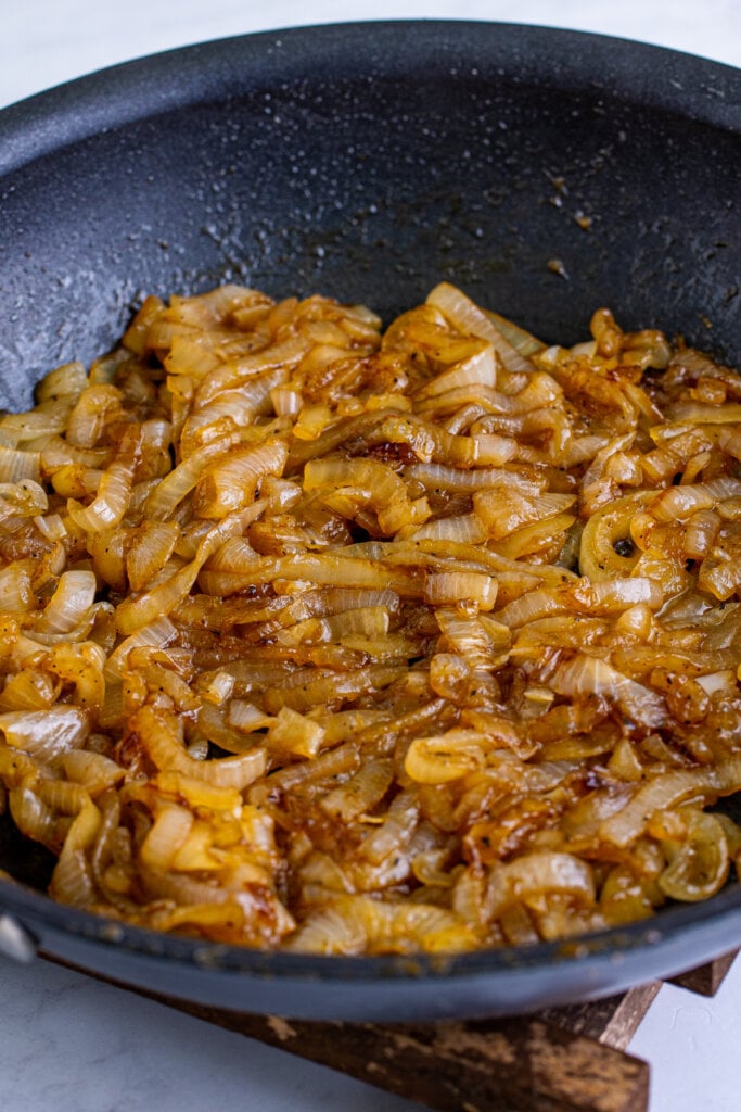 coca cola caramelied onions in pan