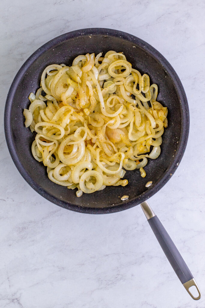 onions beginning to brown in a skillet