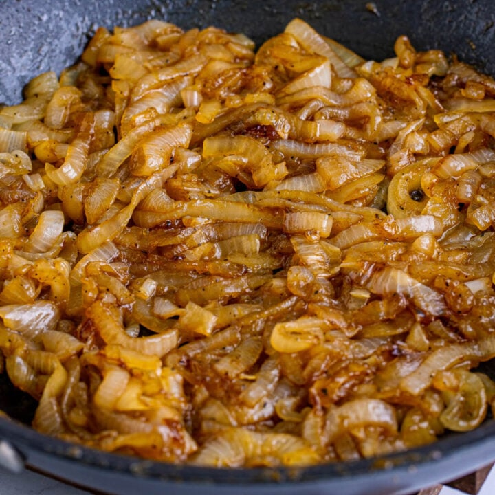 closeup of coca cola caramelized onions in pan