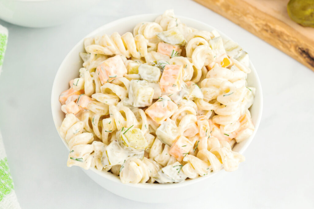 looking down into a bowl of dill pickle pasta salad