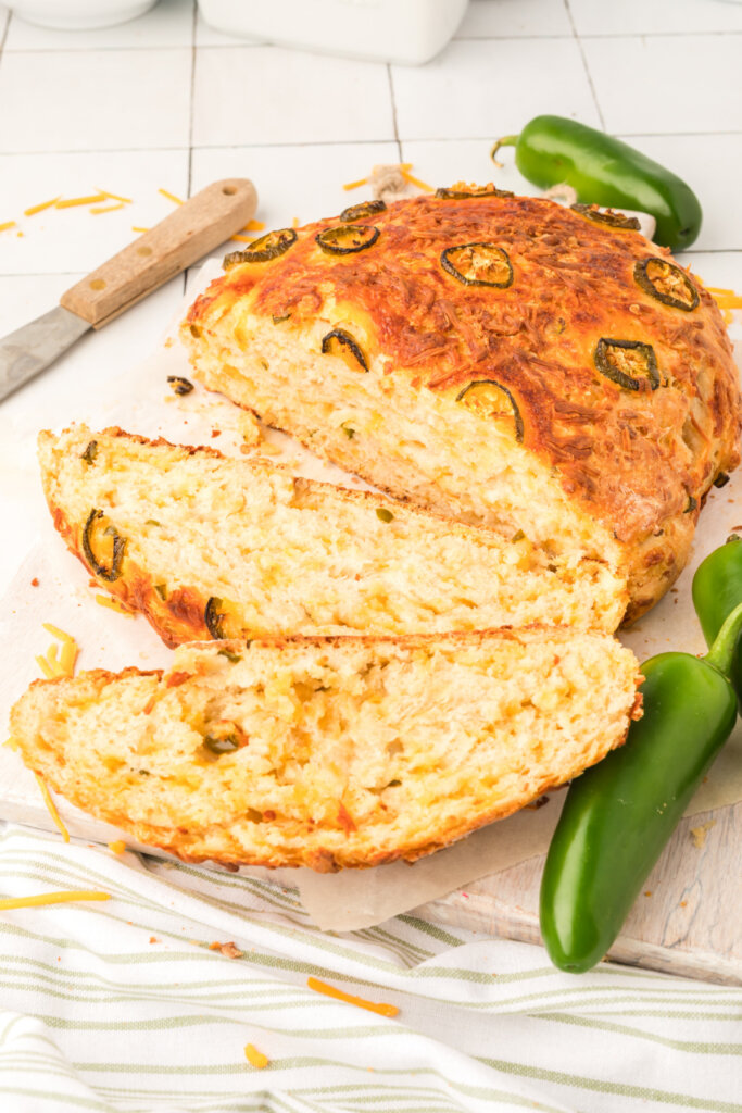 jalapeno cheddar no knead bread with slices cut