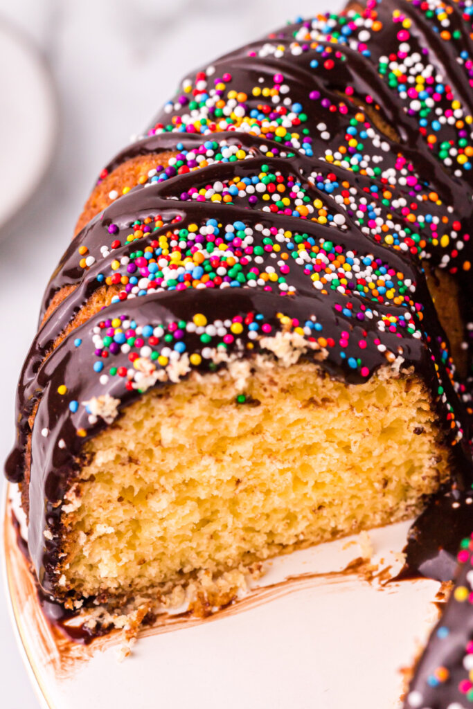 closeup of melted ice cream bundt cake with slice missing