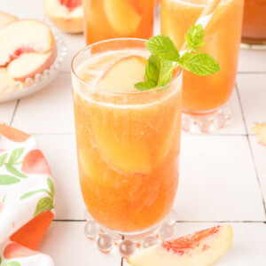 glass filled with peach iced tea