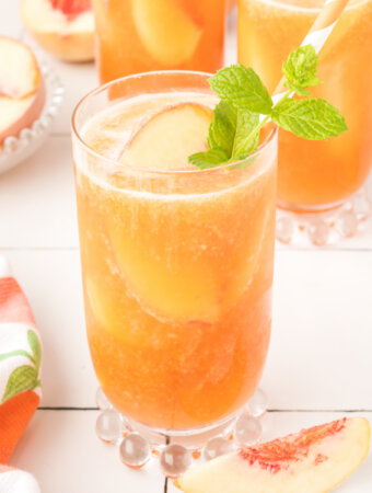 glass filled with peach iced tea