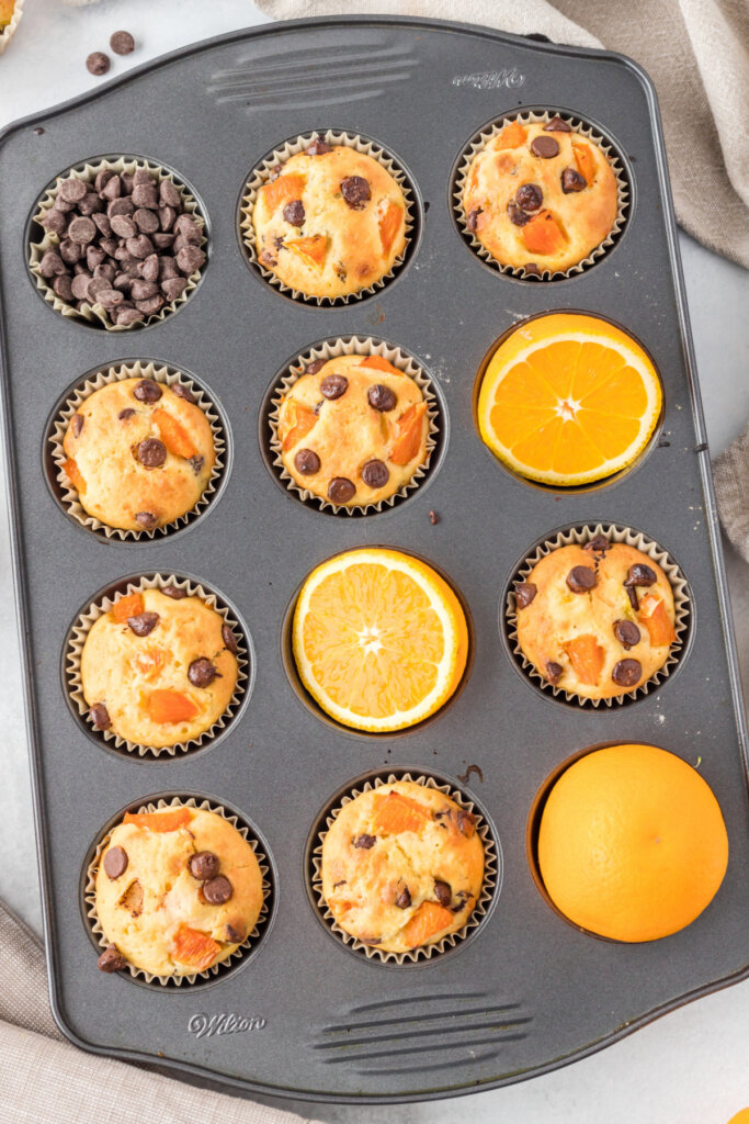 orange muffins in muffin tin