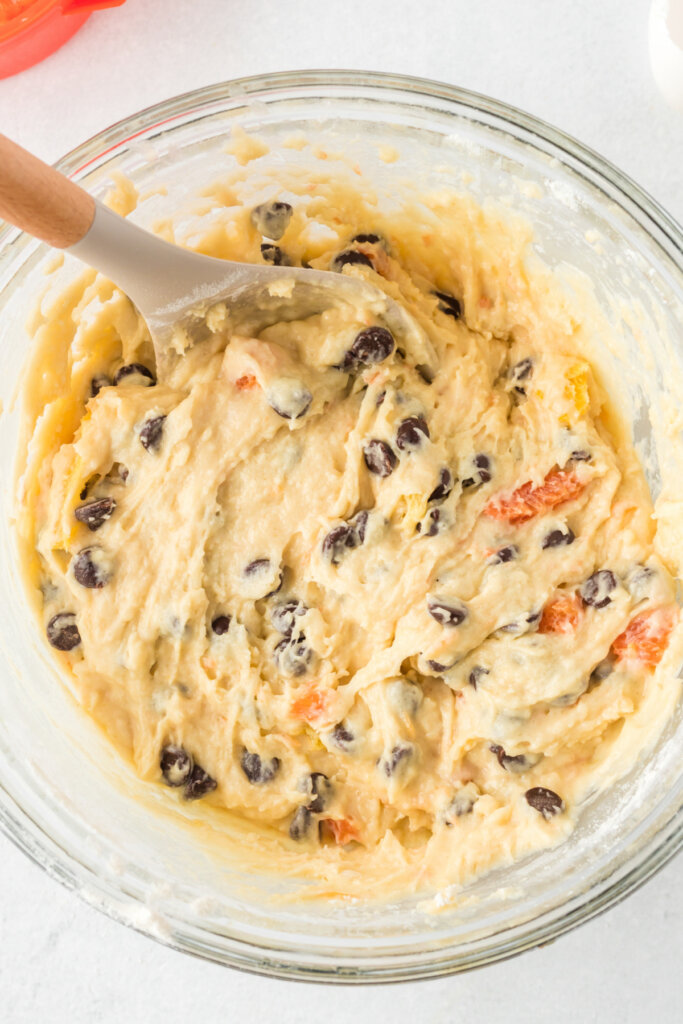 orange muffin batter in bowl