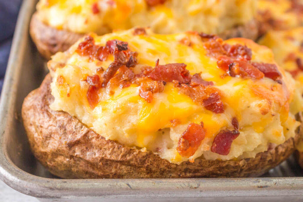 closeup of a grilled twice baked potato on a baking sheet