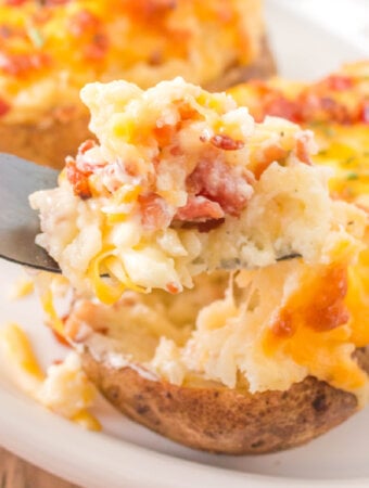 closeup of twice baked potato being scooped