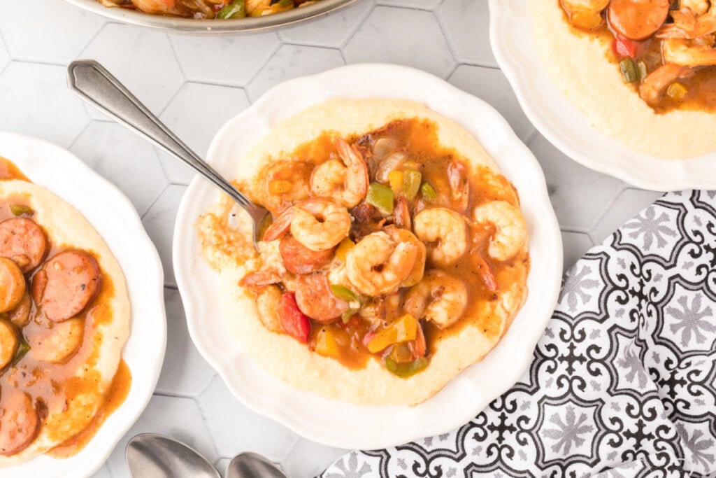 looking down onto a plate with shrimp and grits