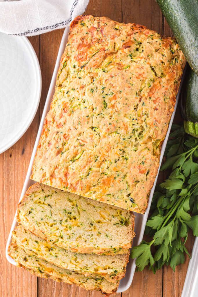 looking down onto a loaf of cheesy zucchini bread