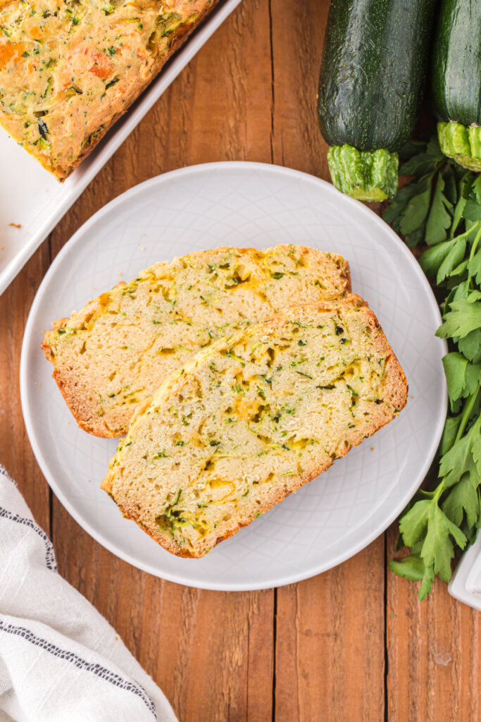 slices of cheesy zucchini bread on a plate