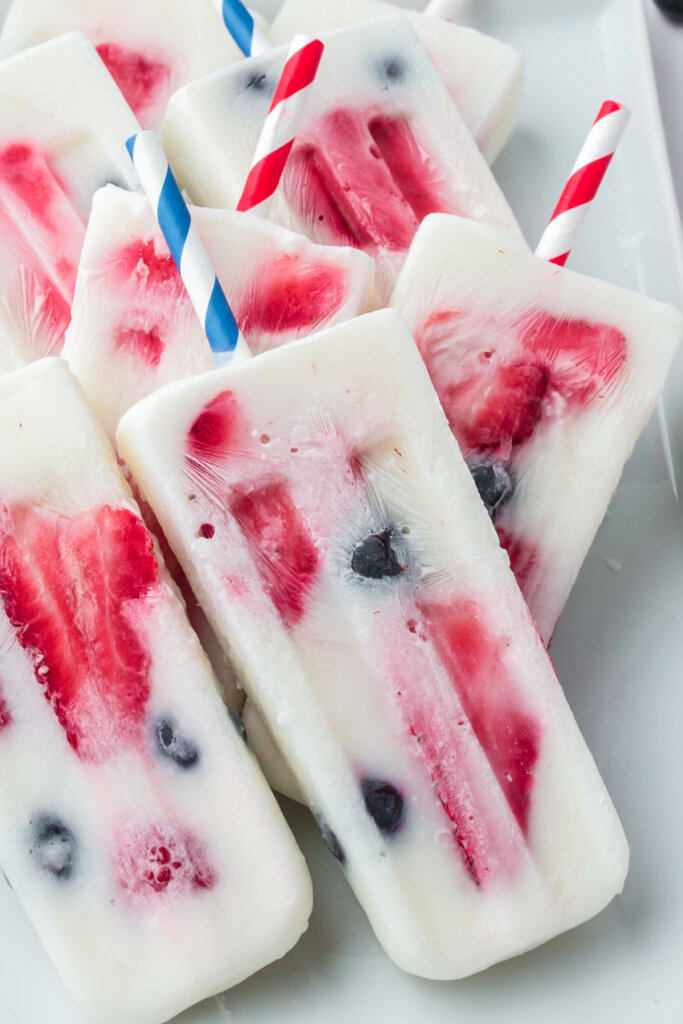 patriotic berry popsicles piled on plate