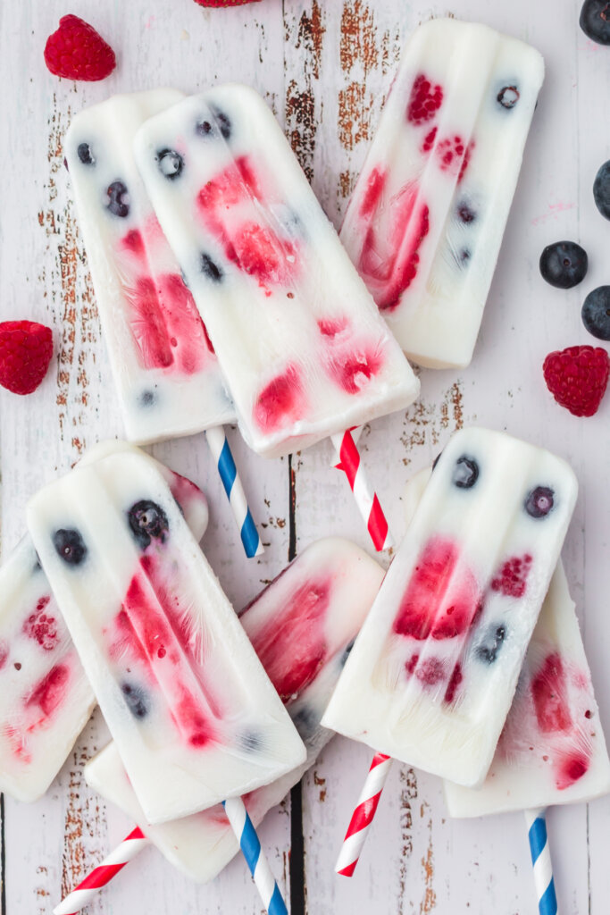 several popsicles laying stacked on table