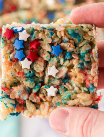 closeup of a hand holding a patriotic rice crispy treat