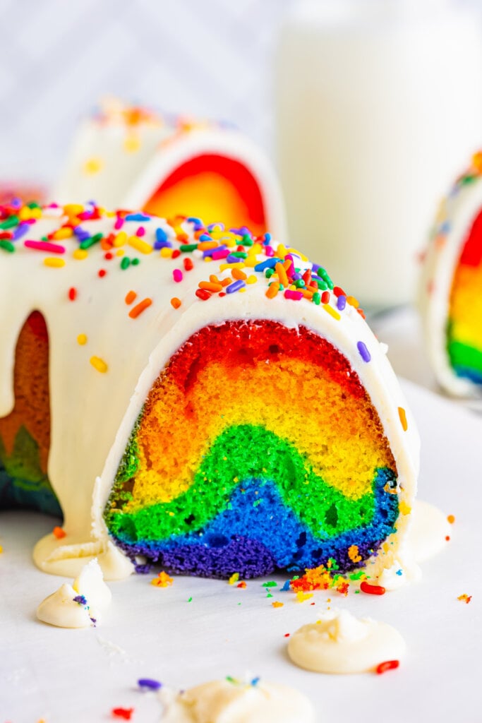 rainbow bundt cake cut to show the inside colors