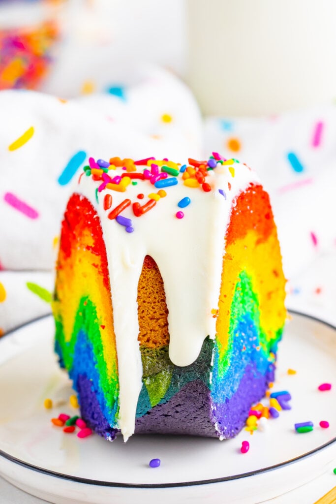 slice of rainbow bundt cake on plate