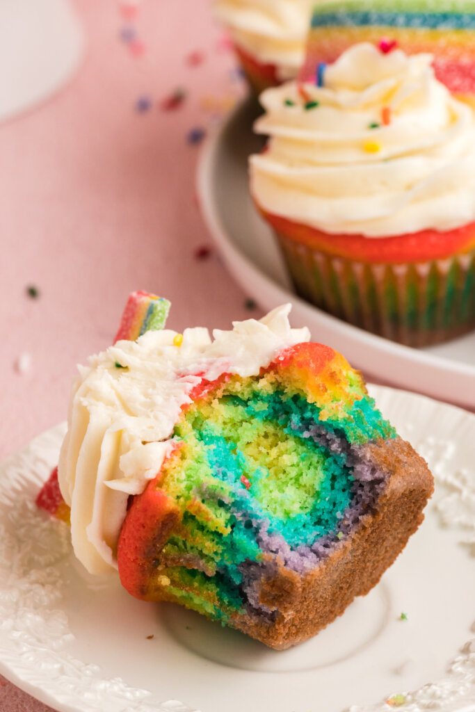 rainbow cupcake on plate showing the colorful inside