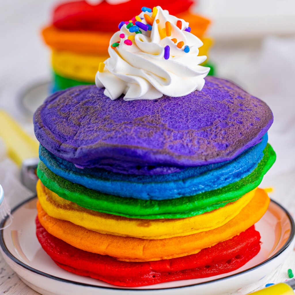 closeup of rainbow pancakes on plate