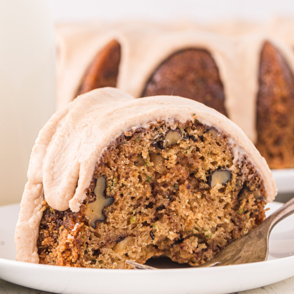 closeup of a slice of zucchini bundt cake on plate