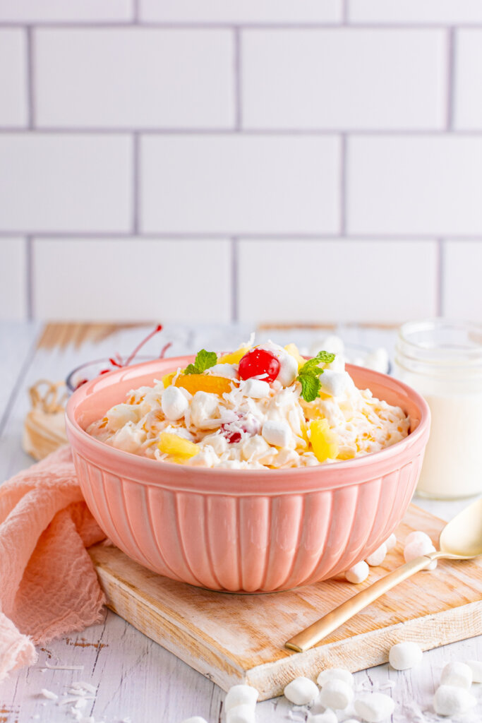 ambrosia salad in pink bowl on counter