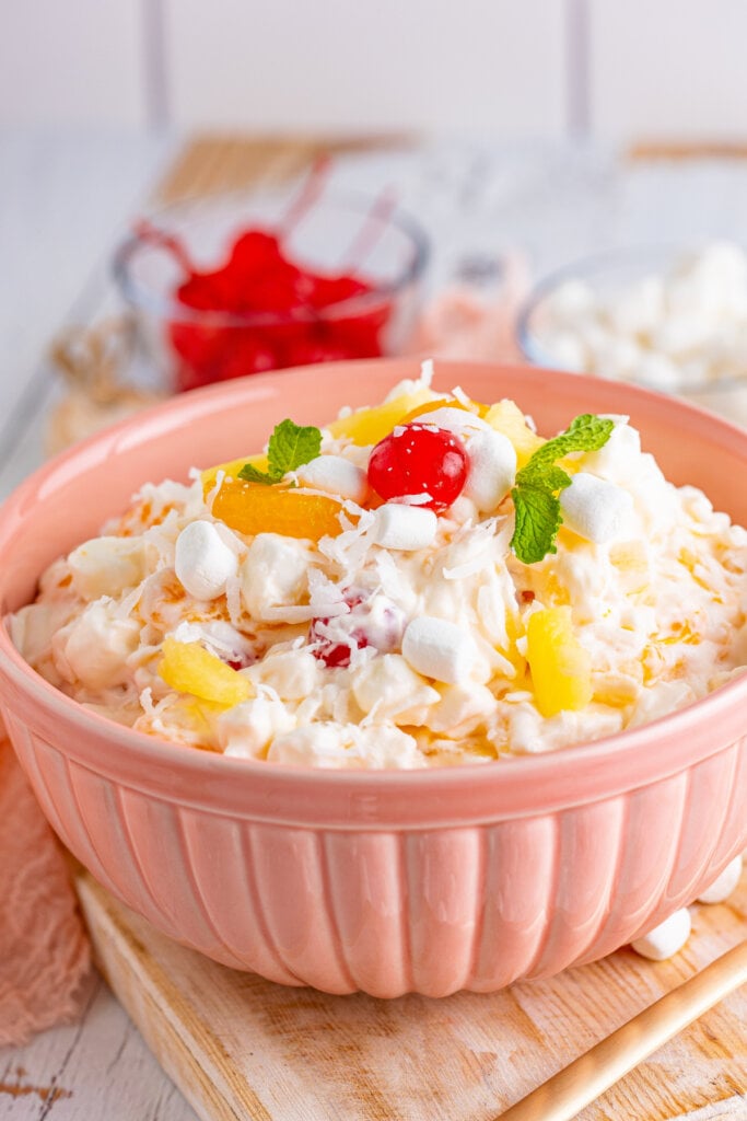 ambrosia salad in pink serving bowl