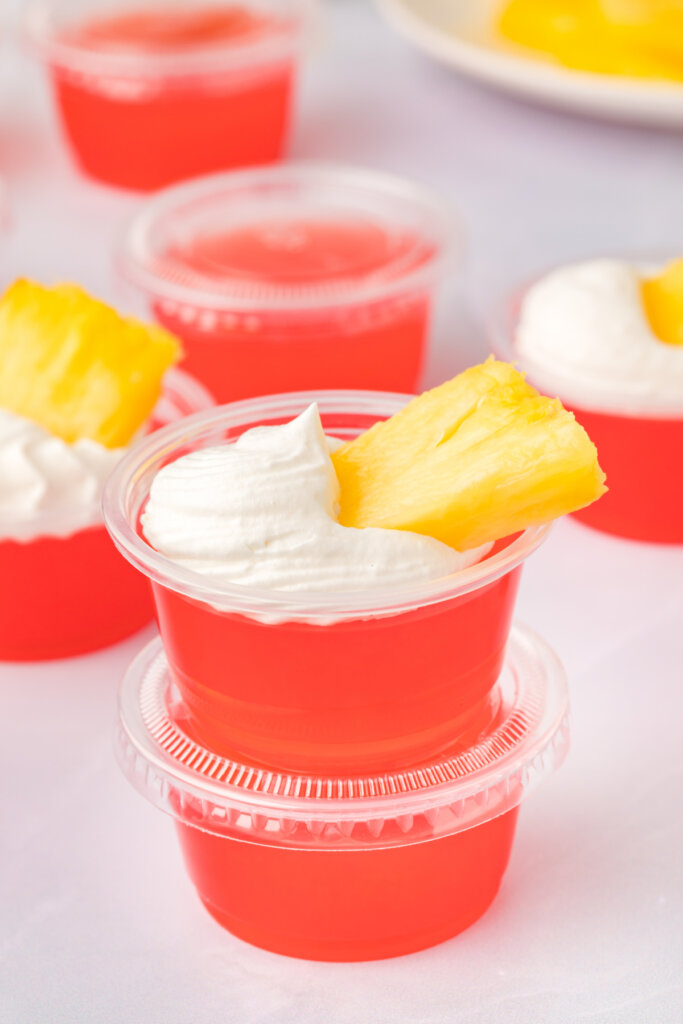 two rum punch jello shots stacked ready to enjoy