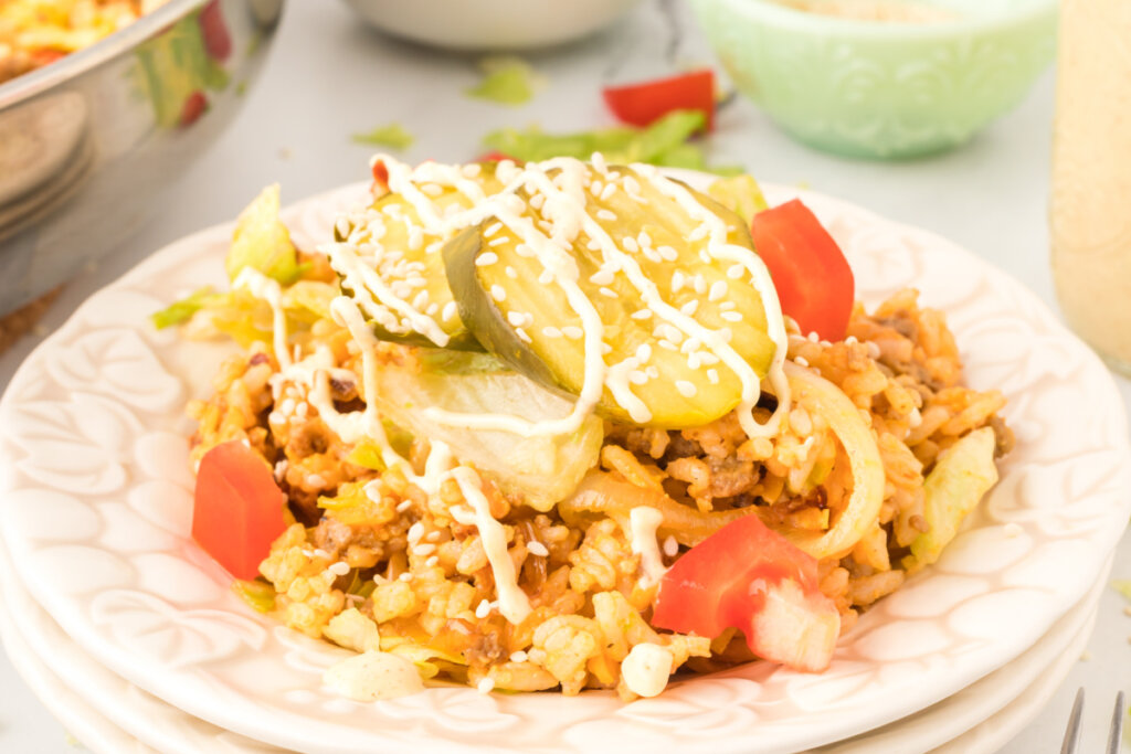 cheeseburger fried rice on white plate