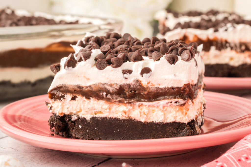 slice of chocolate lasagna lush on pink plate