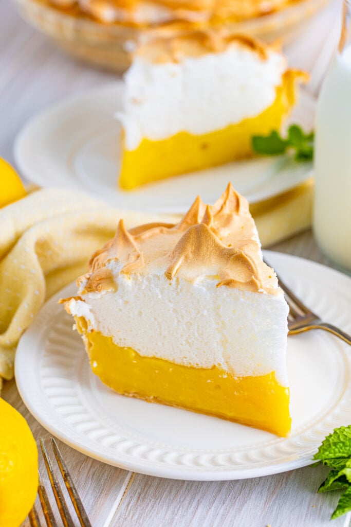 slice of lemon meringue pie on white plate