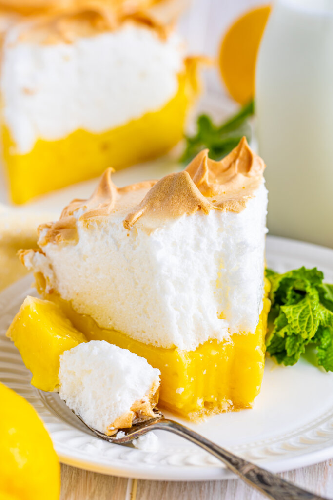 lemon merinue pie with a bite on a fork