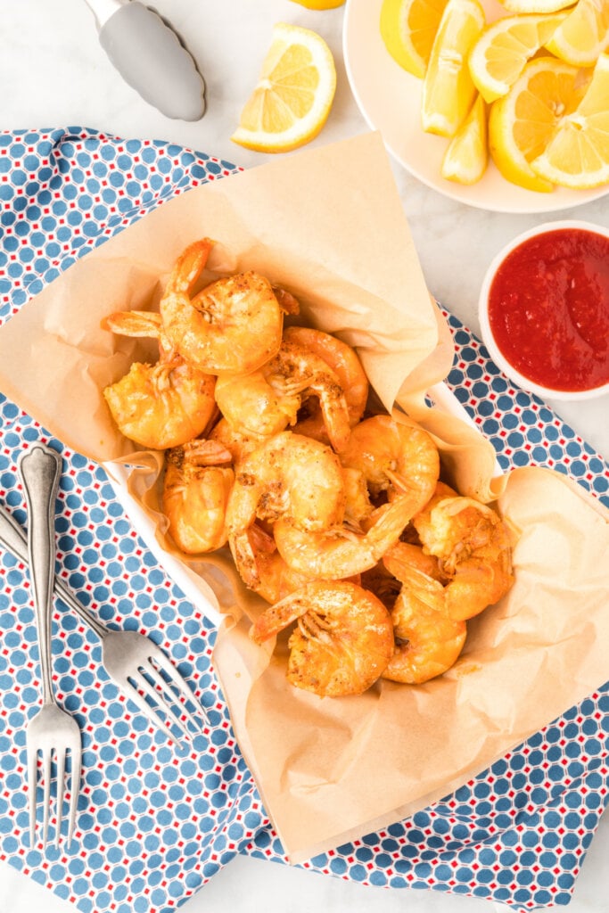 looking down onto a basket full of peel and eat shrimp