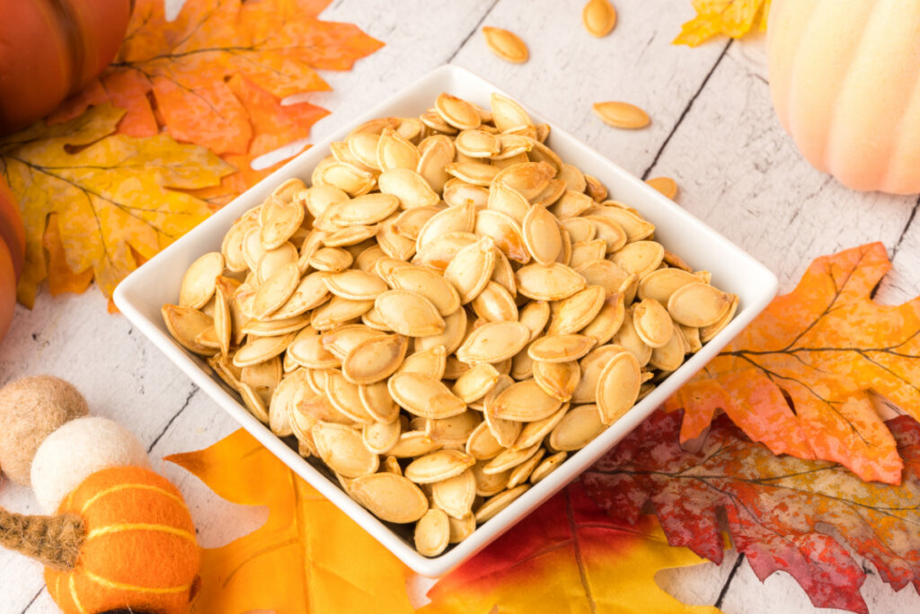 square white bowl with roasted pumpkin seeds