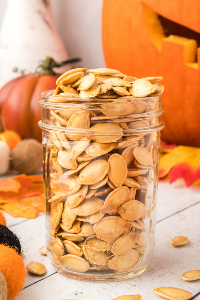 glass jar holding roasted pumpkin seeds