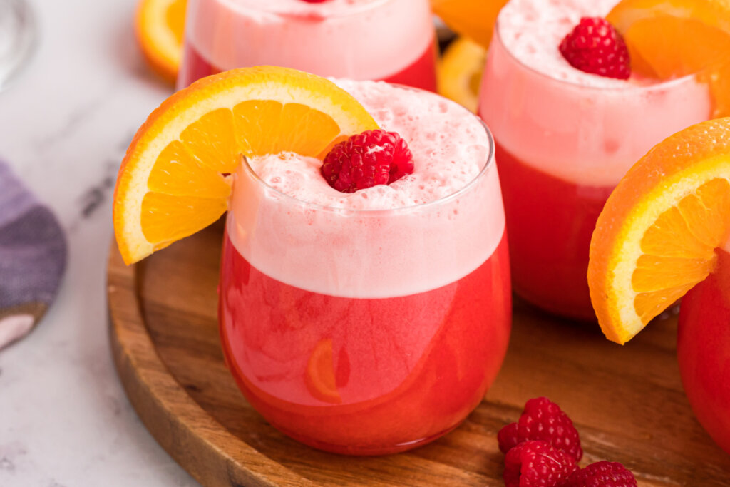 garnished sherbet party punch on wooden serving board