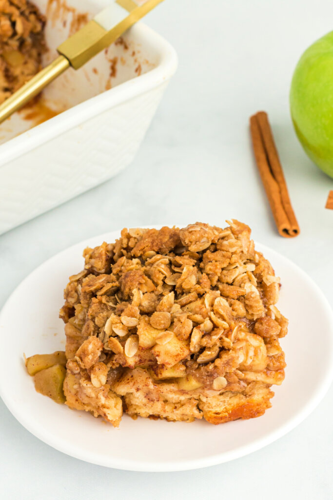 portion of apple cinnamon roll bake on plate without any icing or ice cream