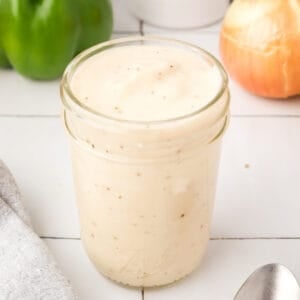 Homemade condensed cream soup substitute in a glass jar, ready to replace canned condensed cream soup in recipes.