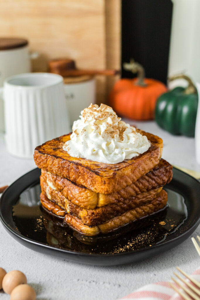 slices of pumpkin spice french toast stacked on plate
