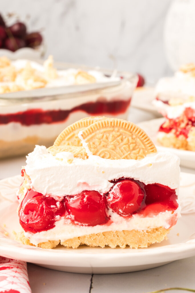 slice of cherry lasagna lush on white plate