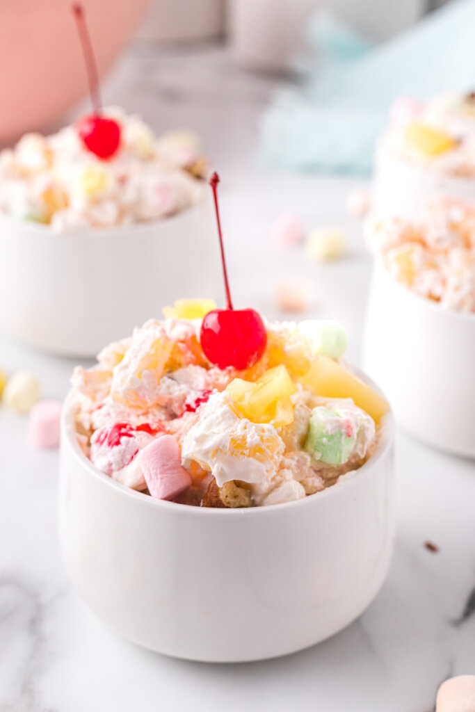 white bowl filled with pineapple fluff salad