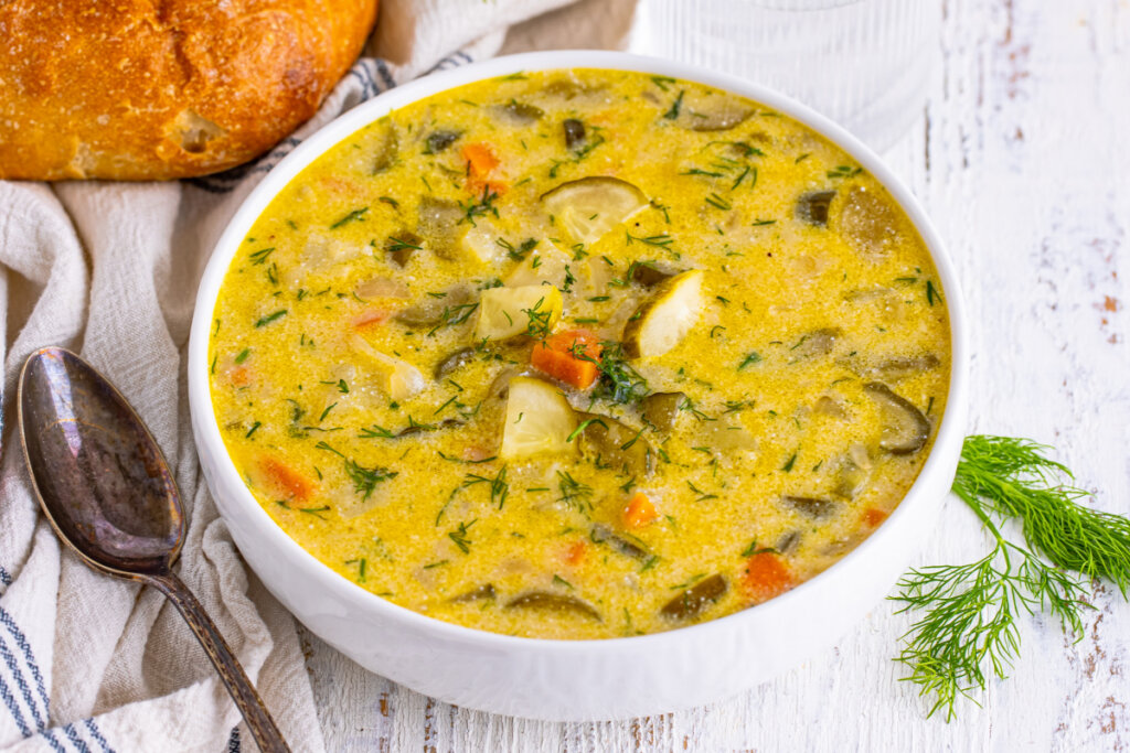 dill pickle soup in white bowl