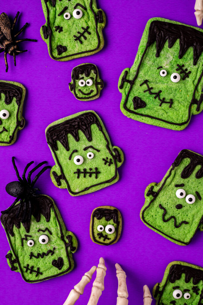 assorted frankenstein cookies on a purple background