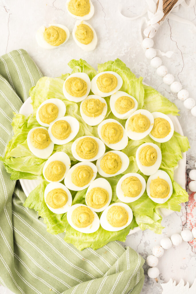 finished pesto deviled eggs on a platter