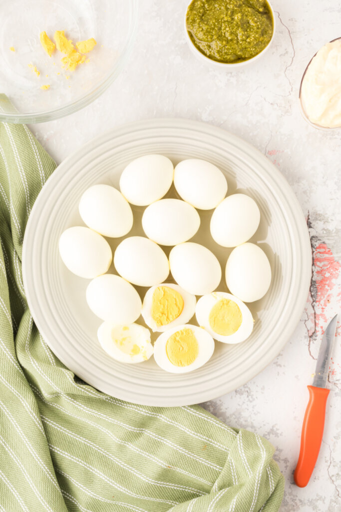 cooked eggs being cut in half