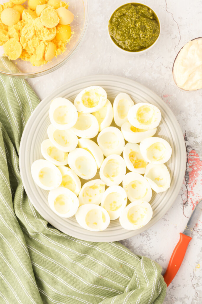 hard boiled eggs cut in half with the yolks removed