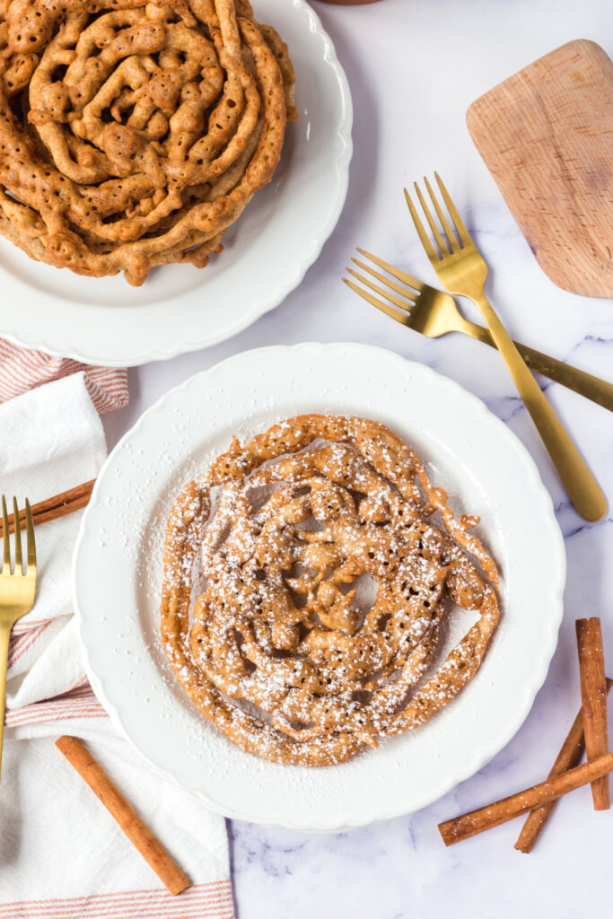 looking down onto a plate with a funnel cake