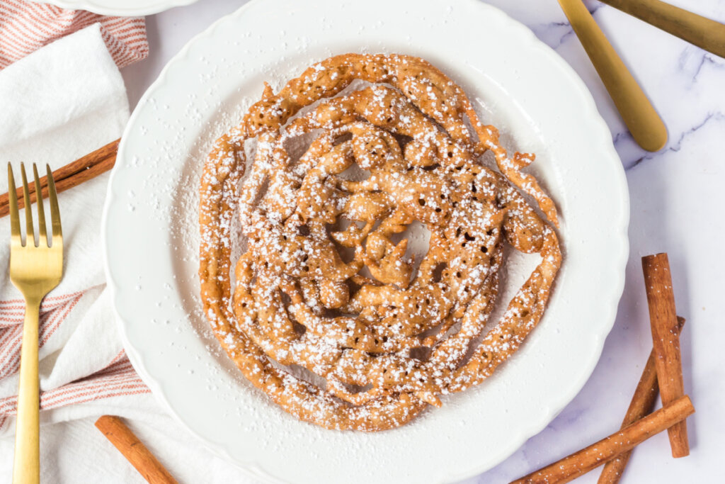 looking down onto a plate with pumpkin spice funnel cake