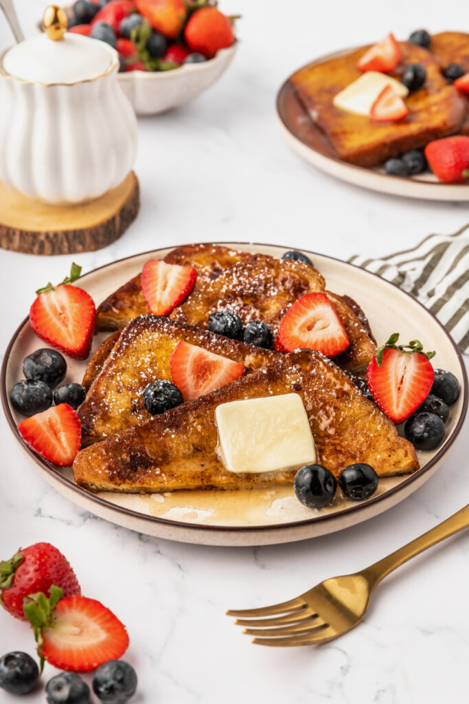 brioche french toast with butter and berries