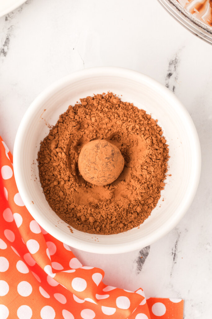 rolling the balls in cocoa powder